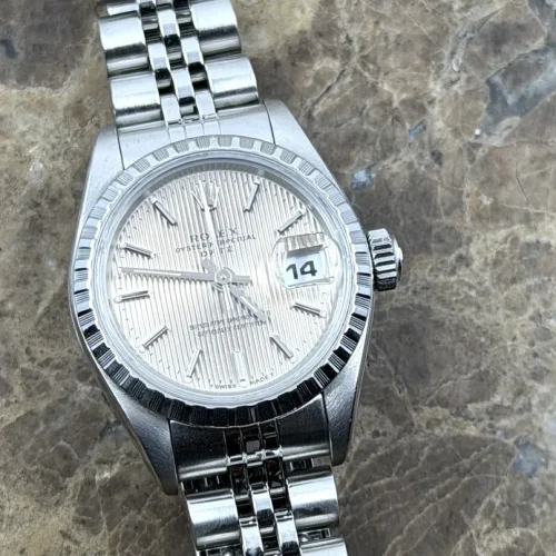 Rolex Lady Oyster Perpetual Datejust 26mm Steel Automatic Silver Tapestry Dial Engine Turned Bezel model 69240